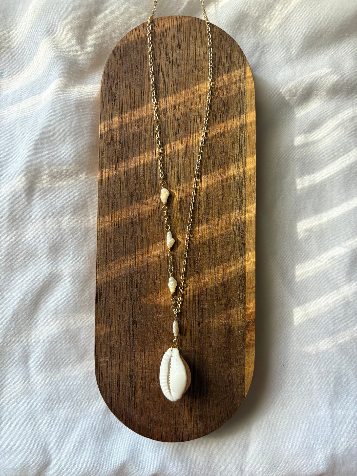 asymmetrical cowrie necklace